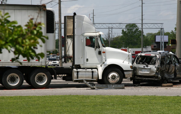 A vehicle being T-boned by a tractor-trailer big rig