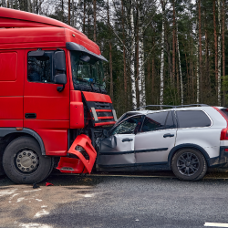 Head-on collision between truck and car