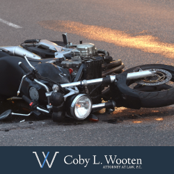 Damaged motorcycle lying on ground after Texas motorcycle accident