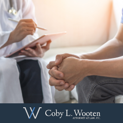 Personal injury victim sitting while speaking with doctor