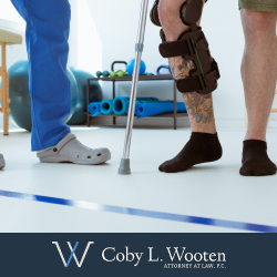 Personal injury victim with leg brace and crutches